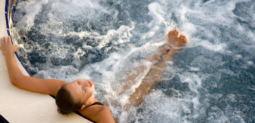 Woman relaxing in a hot tub