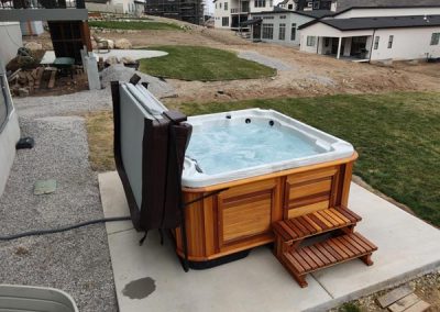 uncovered hot tub arctic spas in red cedar cabinet